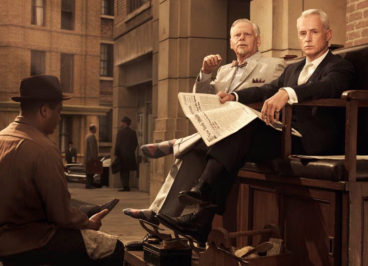 Roger Sterling getting his shoe shined