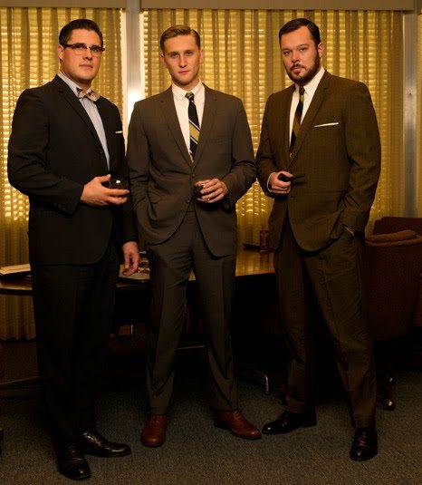 Mad Men cast wearing suits in difeering shades of brown