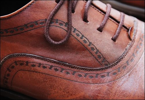 Brown dress shoes detail