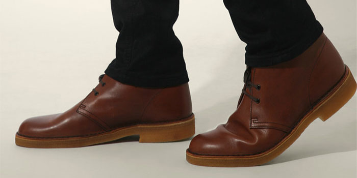 brown leather chukka boots worn with jeans