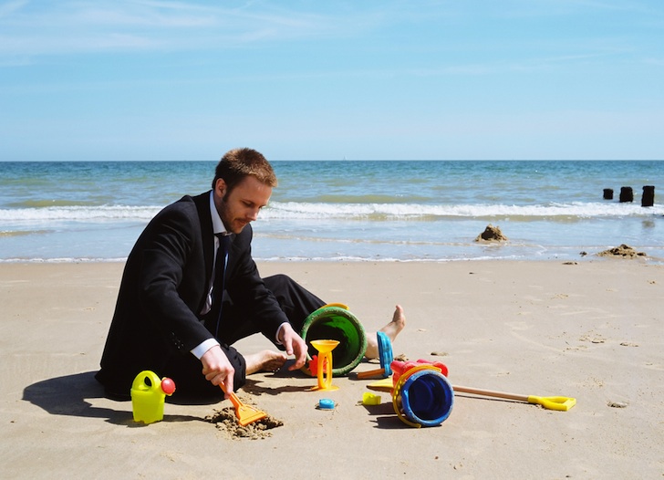 man in suit on the beach