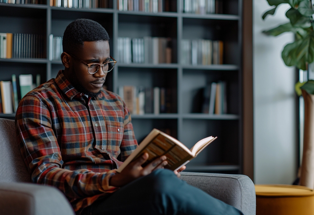 guy in glasses reading book