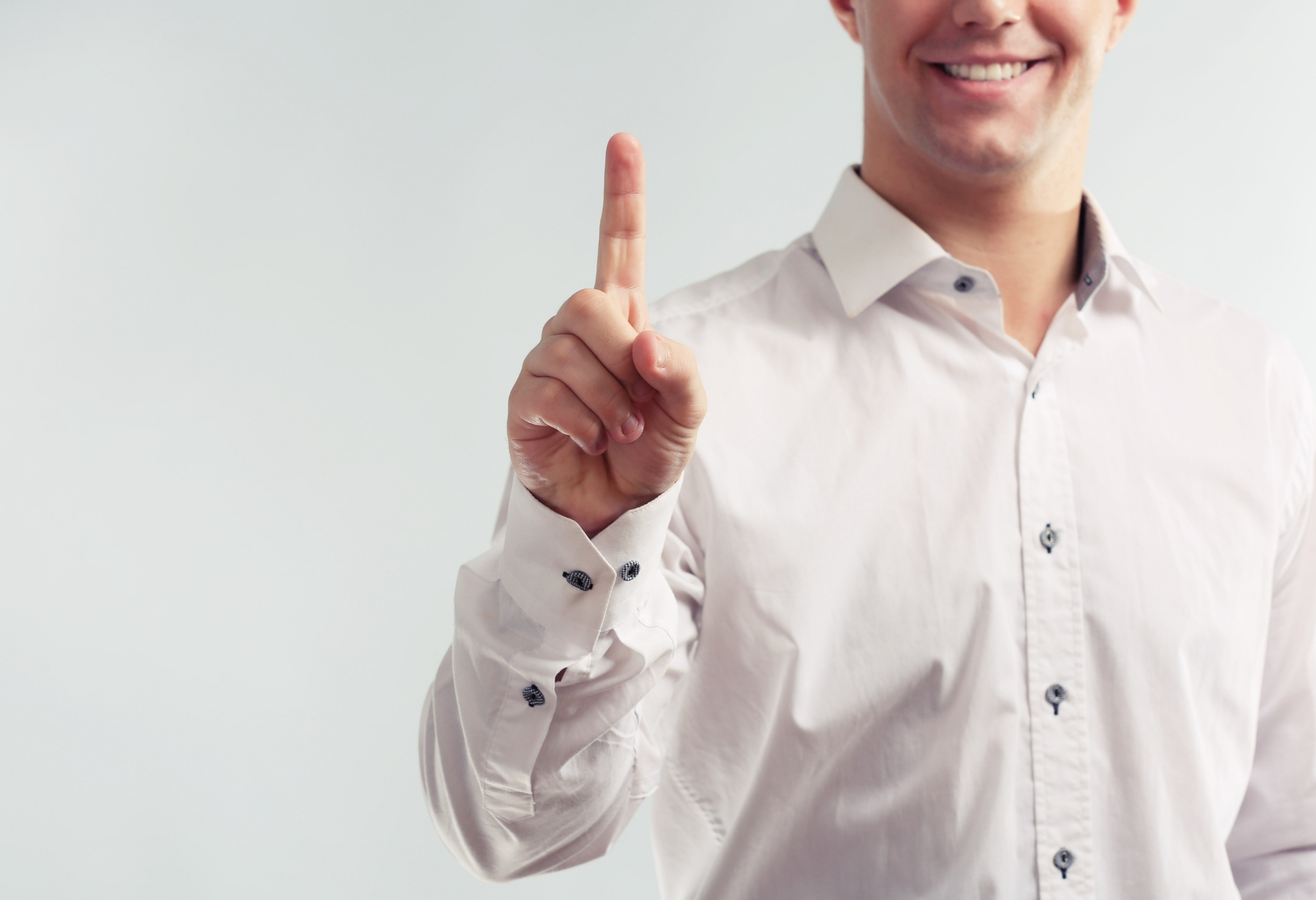 a man with holding up one finger to symbolize his one goal per day - tips to increase productivity
