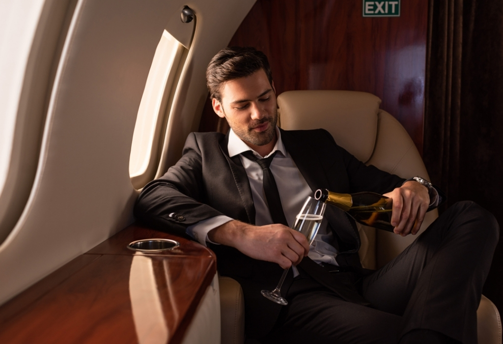 man in suit on plane