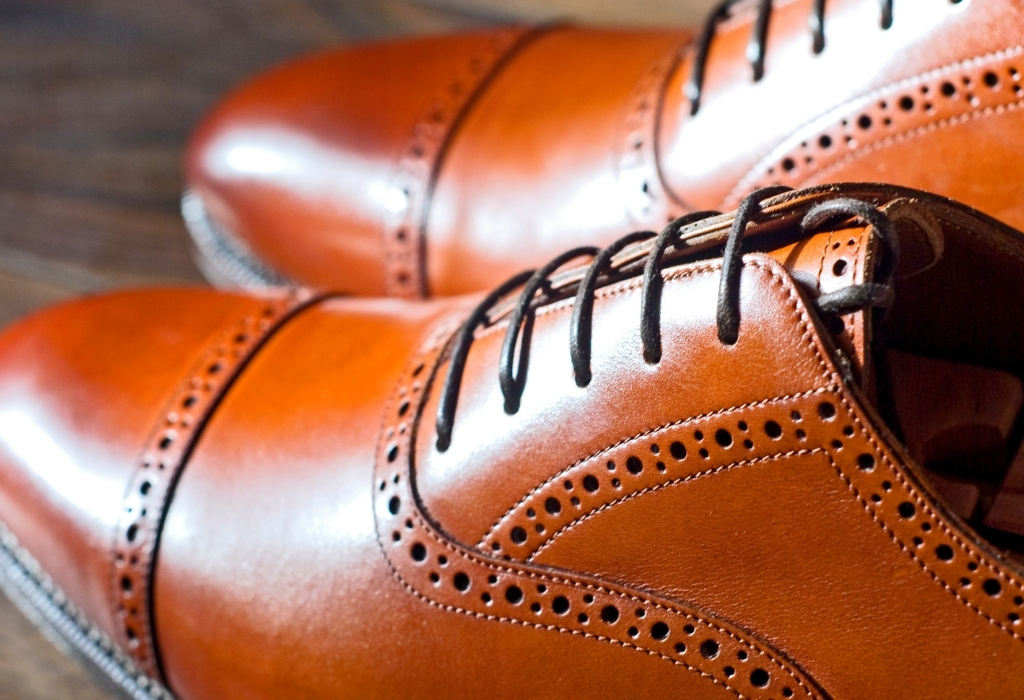 Brown Oxford shoes feature on a good travel packing list 
