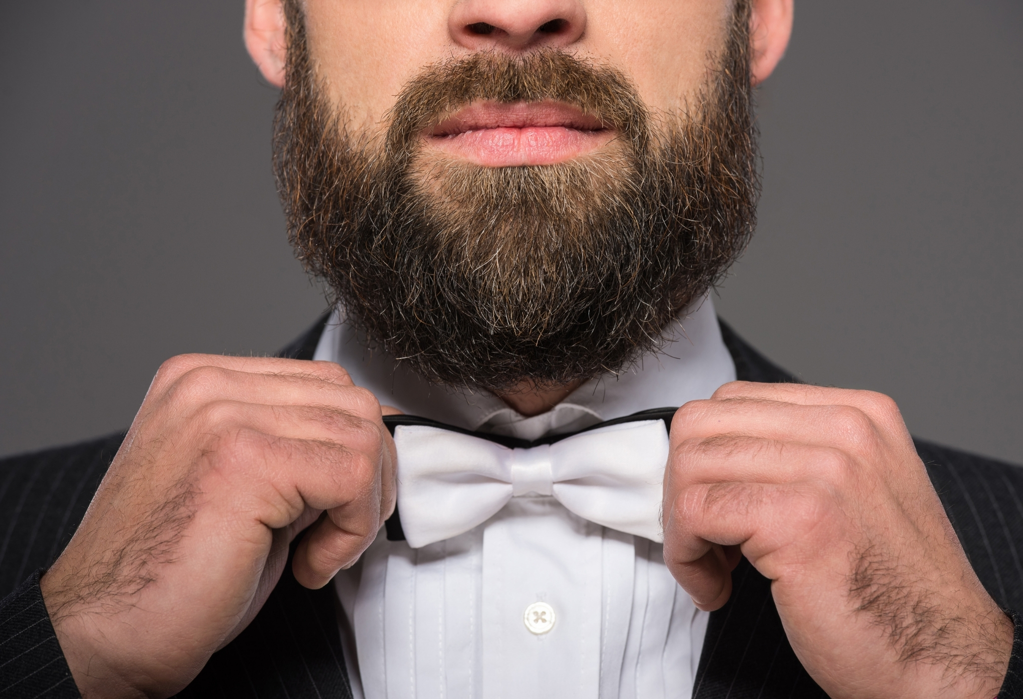 man with beard wearing white tie