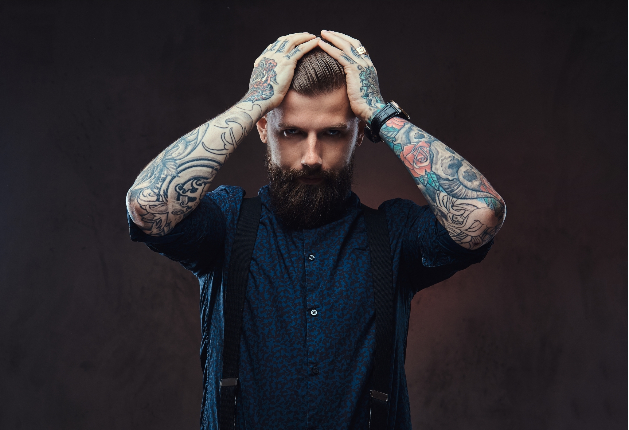 concerned man with tattoos
