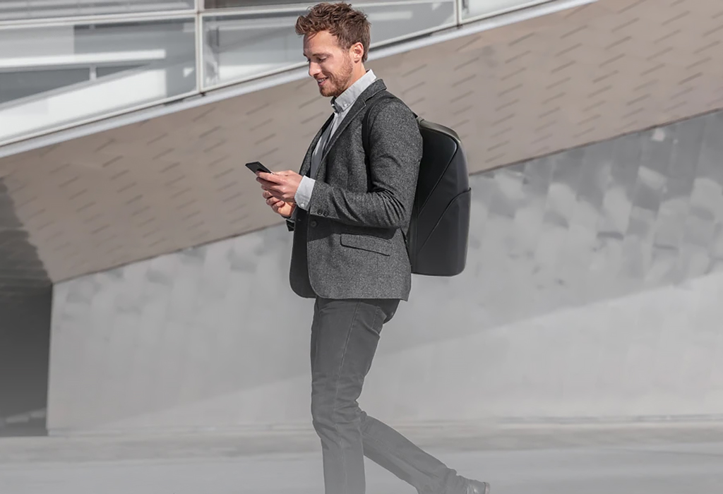 Man wearing backpack with suit