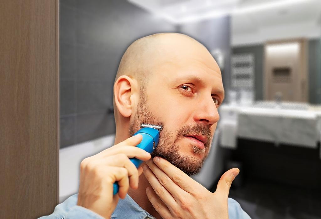 man shaving with electric razor