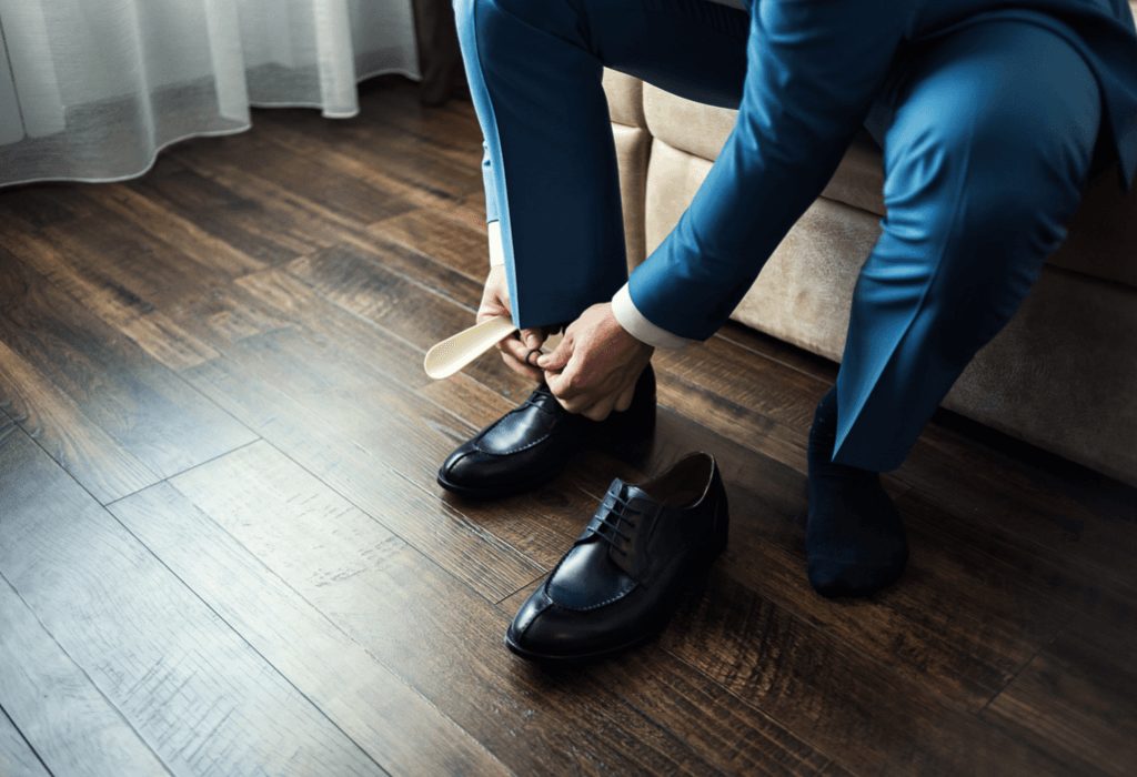 Man putting on shoes 