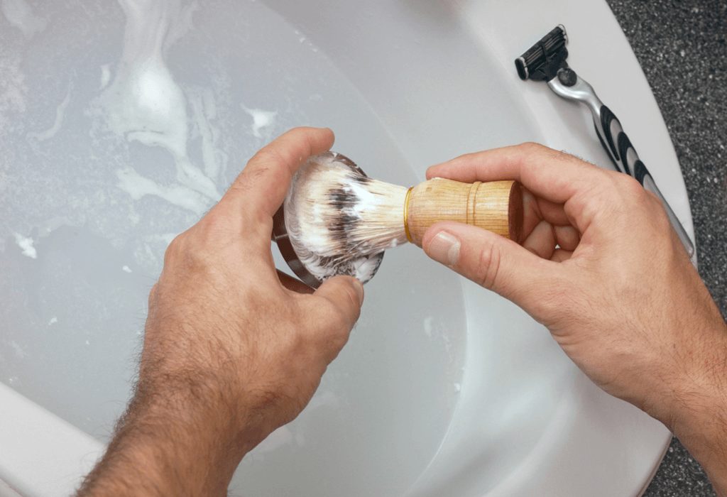 Shaving brush covered in shaving foam
