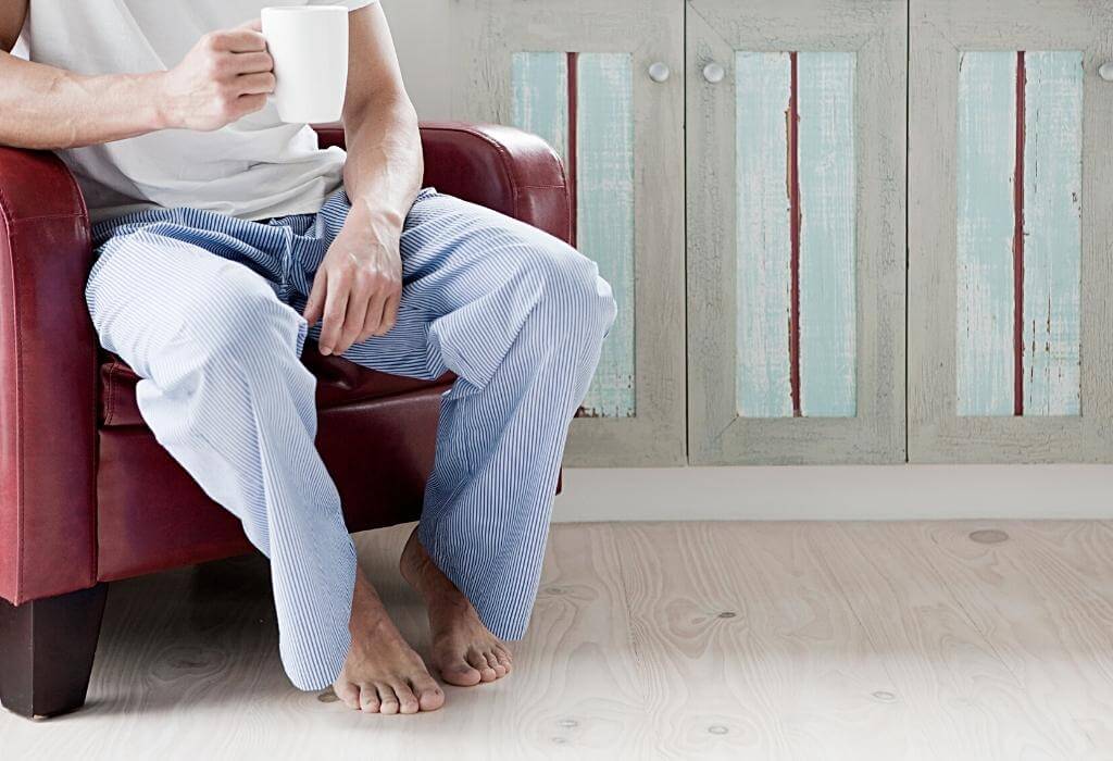 Man sitting in pajamas - another example of men’s home essentials