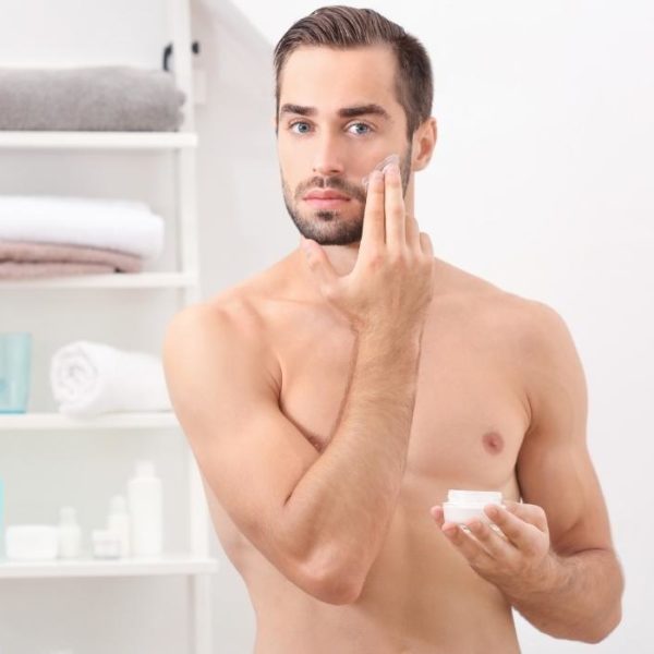 man using face scrub