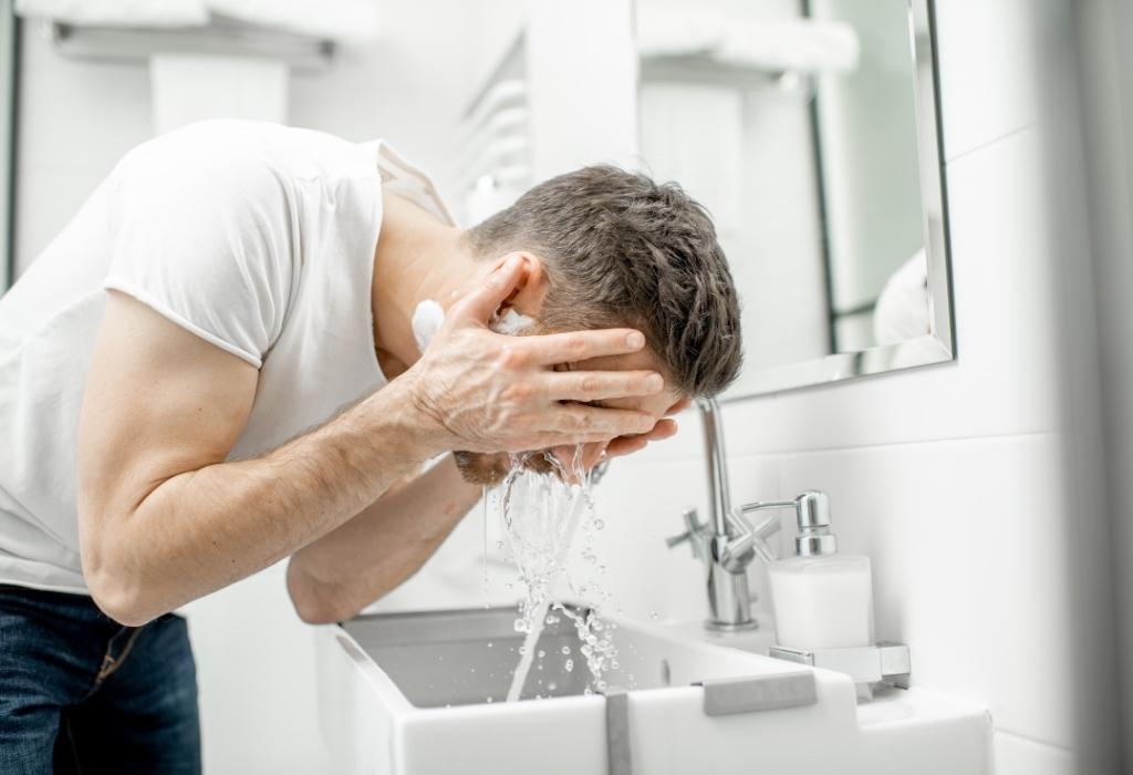 man washing face 
