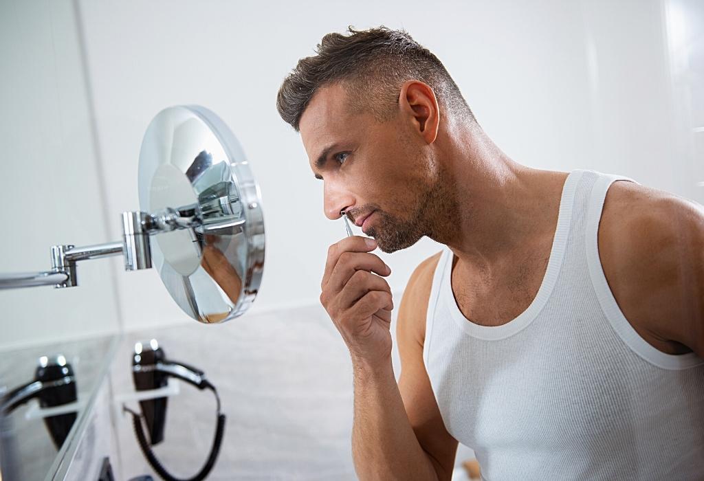 man grooming nose hair - avoiding this classic grooming mistake 