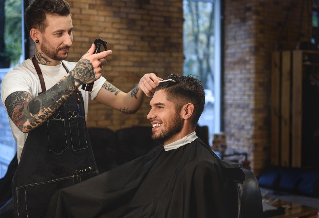 barber cutting hair - avoiding is a grooming mistake all men make 