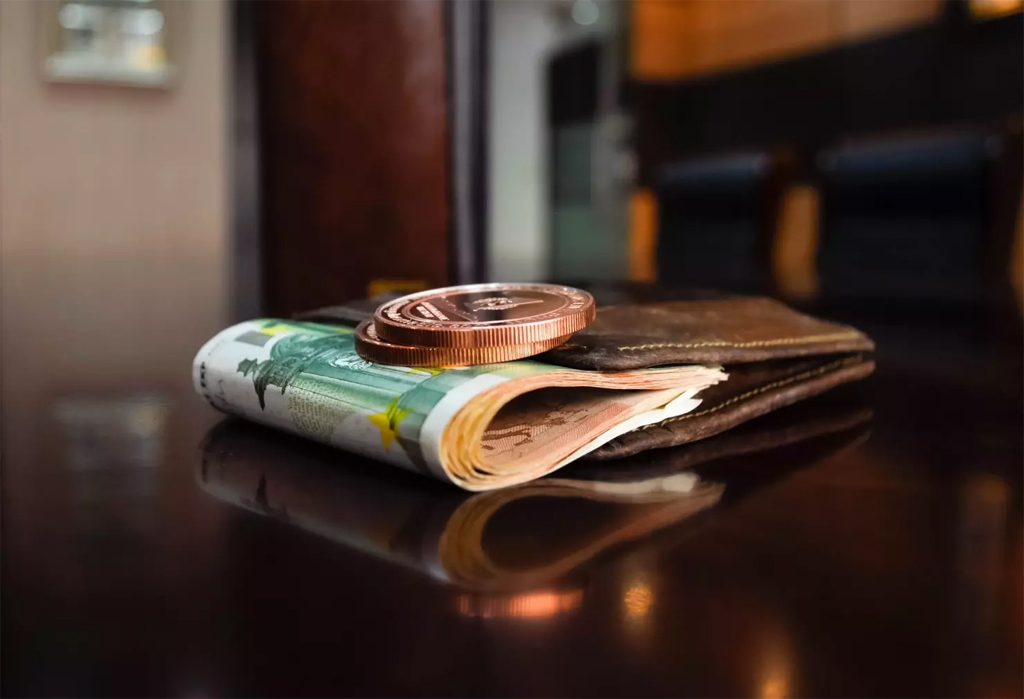 wallet with money on table