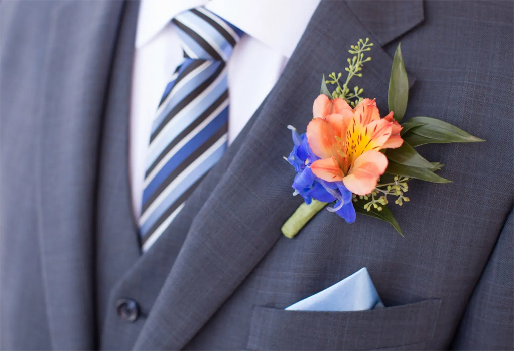 man in suit wearing a boutonniere for wedding