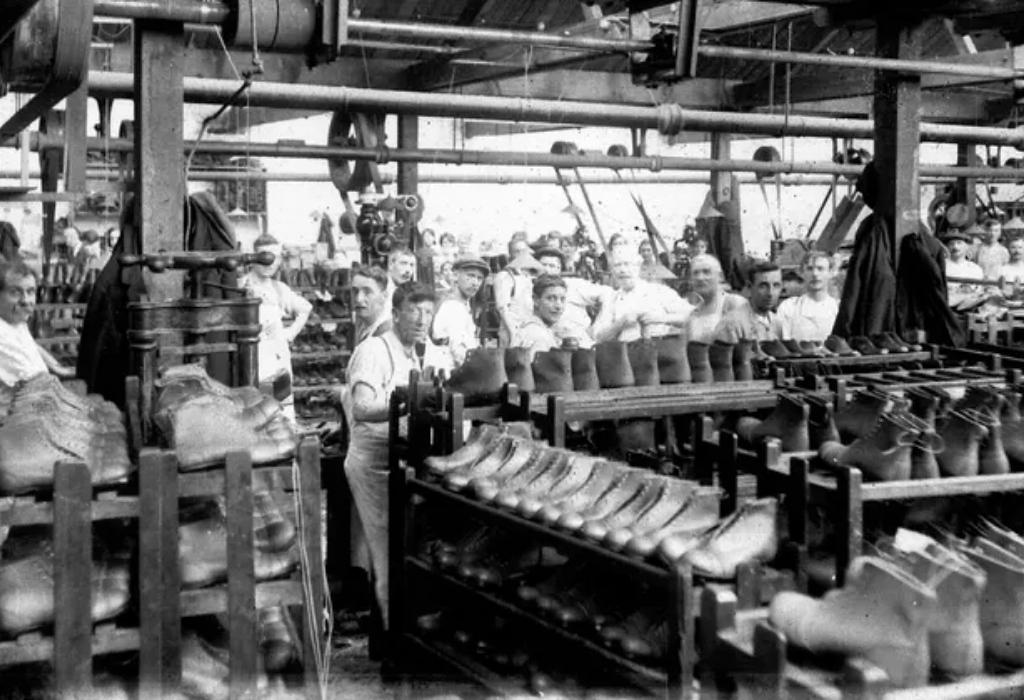 old image of men working in dr martens factory 