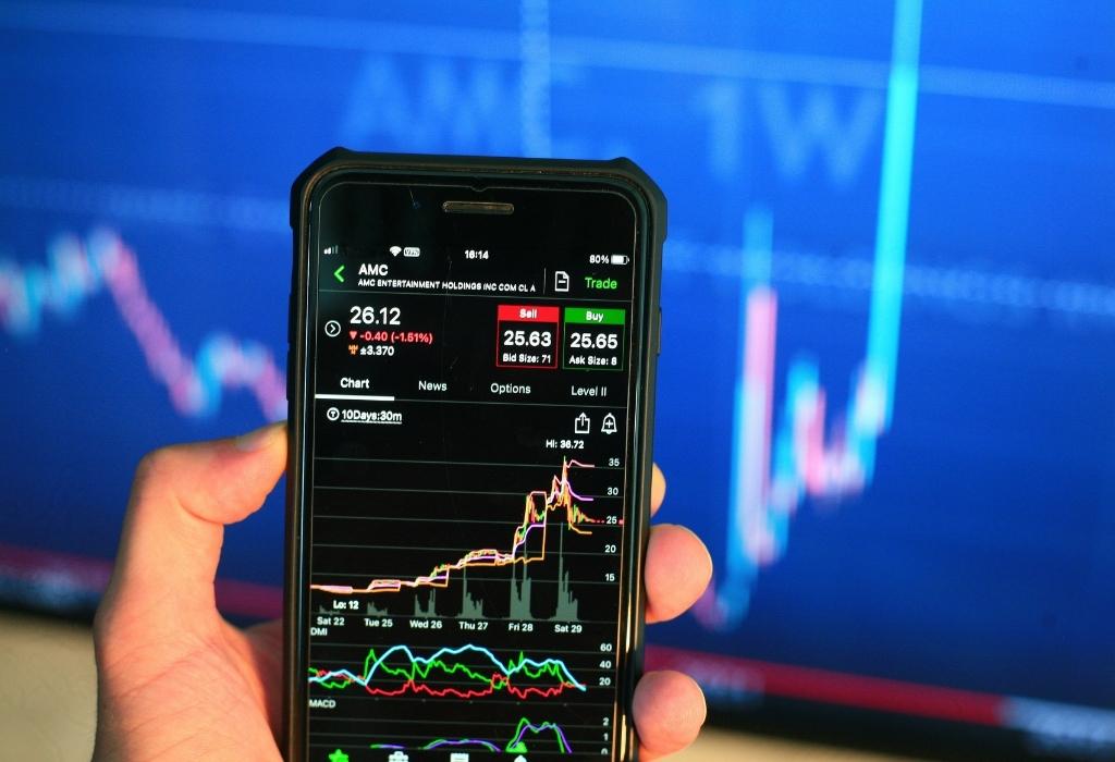 man looking at stock on phone