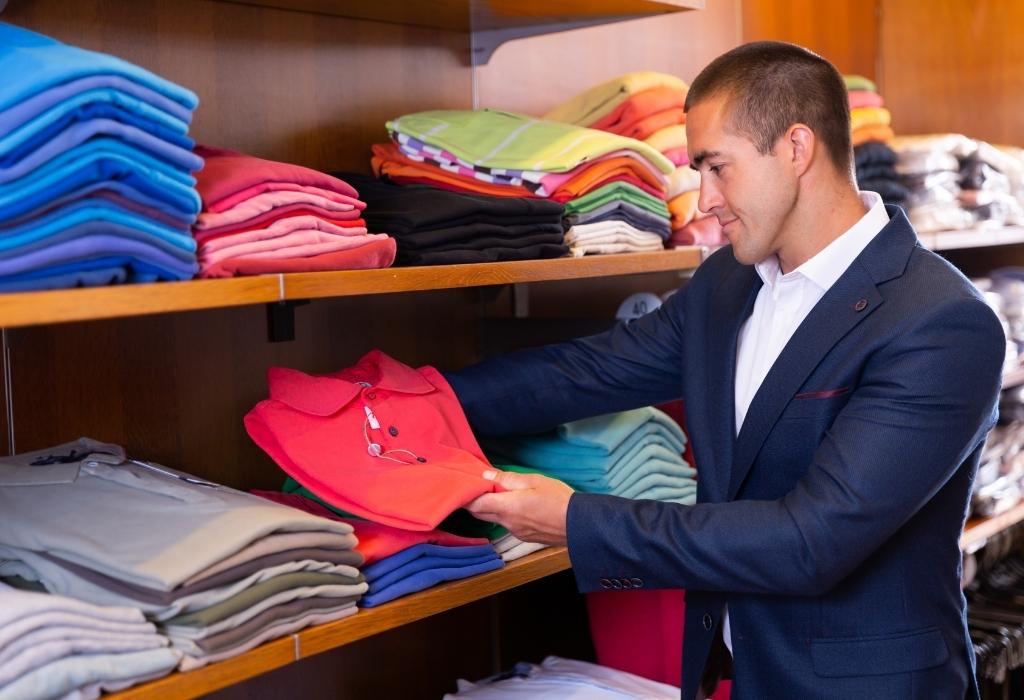 man buying red polo wearing suit