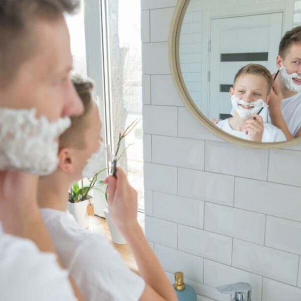 dad teaching son to shave