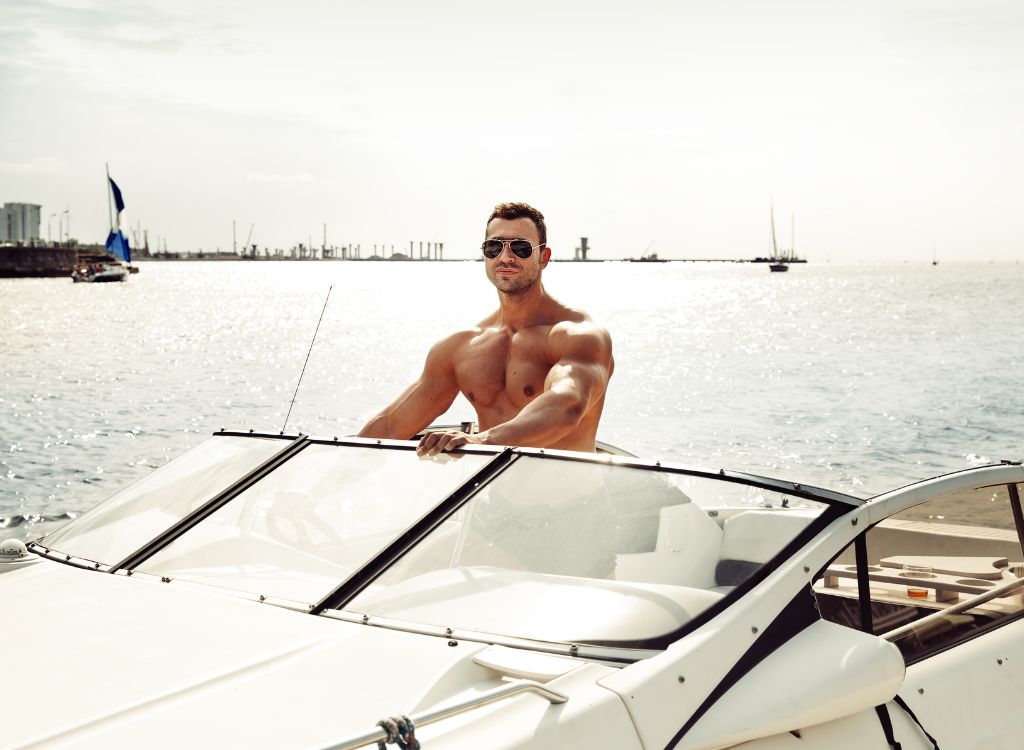 muscled man on yacht
