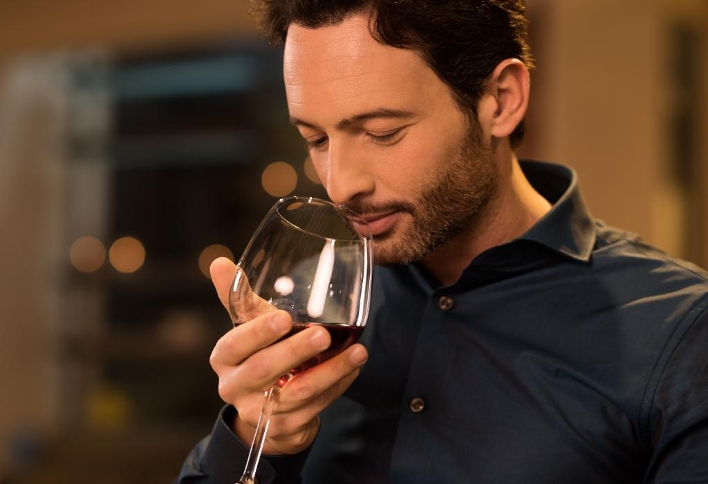 man smelling wine - psychology of scent