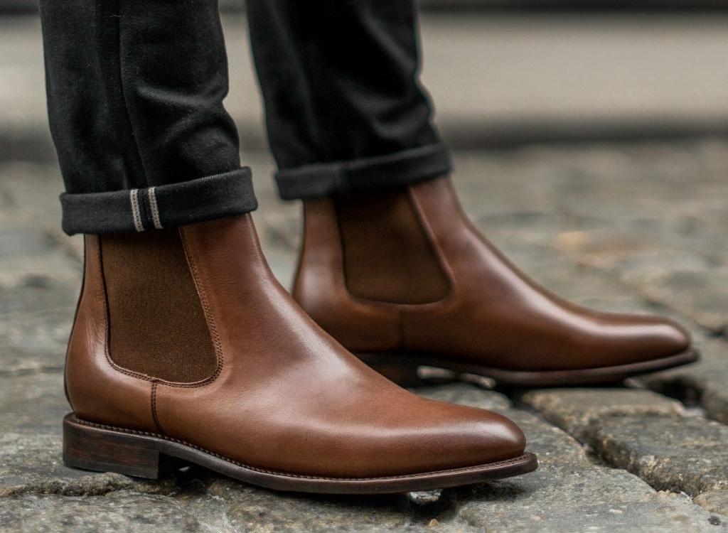 chelsea boots with jeans worn by man