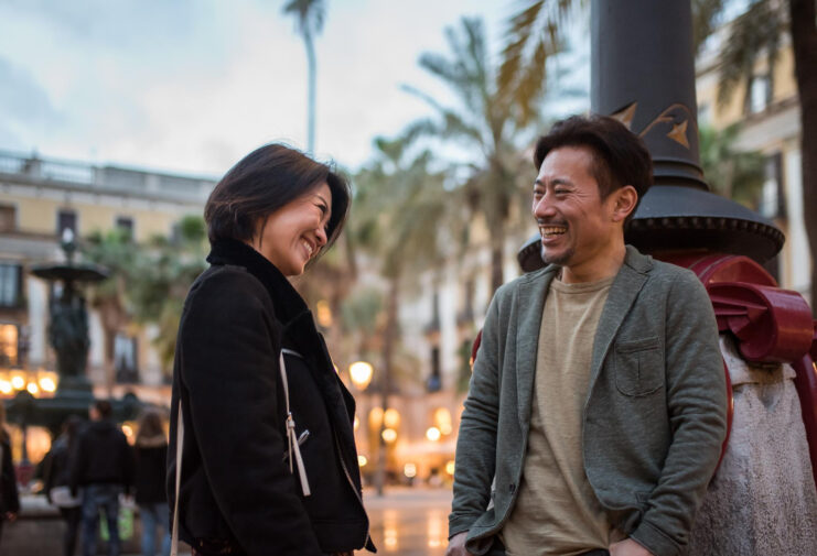 asian-happy-tourist-couple-talking-square