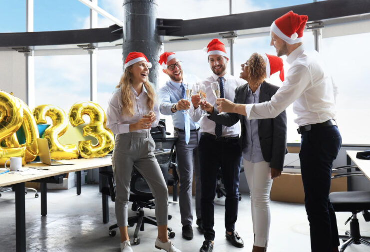 business-people-are-celebrating-holiday-modern-office-drinking-champagne-having-fun-coworking-merry-christmas-happy-new-year-2023 (1)