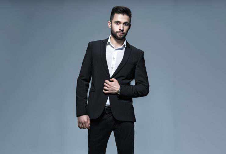 handsome-man-black-suit-with-white-shirt-posing-attractive-guy-with-fashion-hairstyle-confident-man-with-short-beard-adult-boy-with-brown-hair-full-portrait (1)