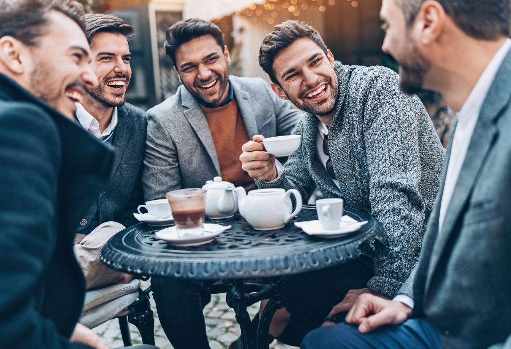 group of nicely dressed men drinking tea and coffee